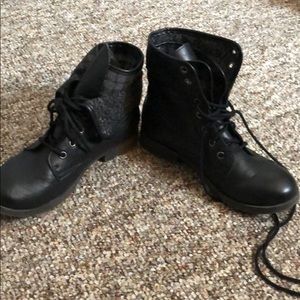 Black lace-up combat boots